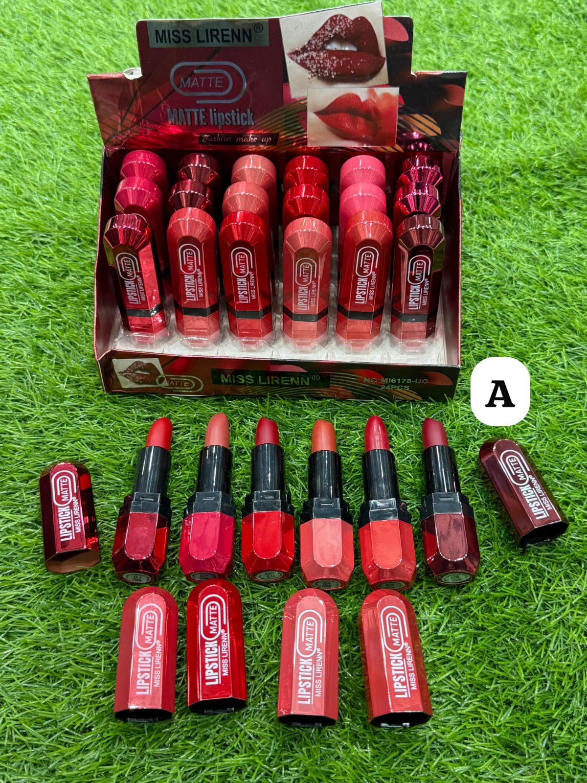 Box of Miss Liren matte lipsticks on a grassy background