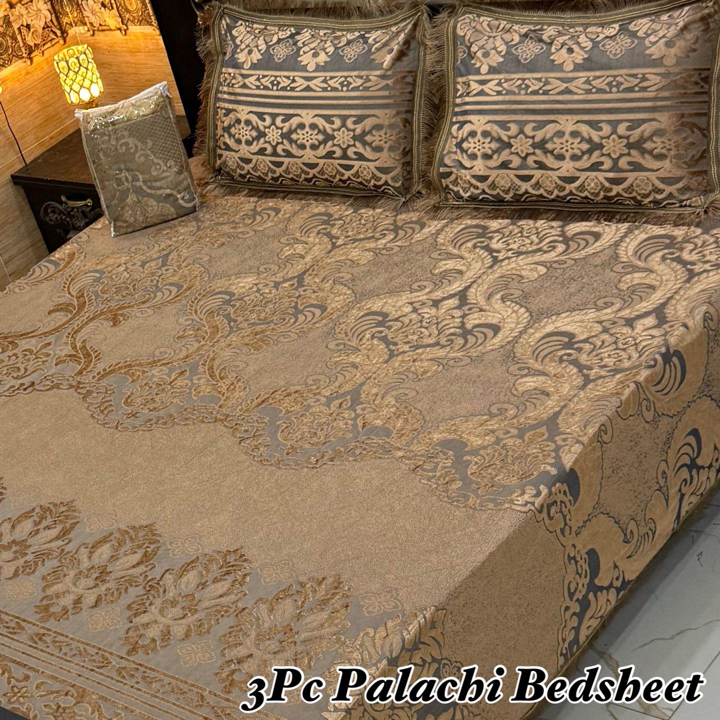 Decorative bedspread with intricate patterns on a bed, featuring the brand '3Pc Palachi Bedsheet'.