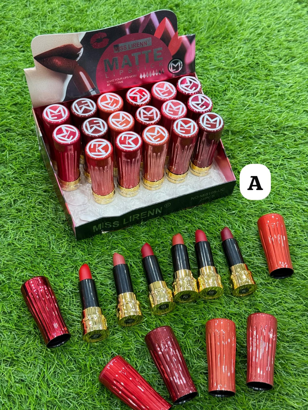 Miss LFirenne lipstick set with packaging on a grass background