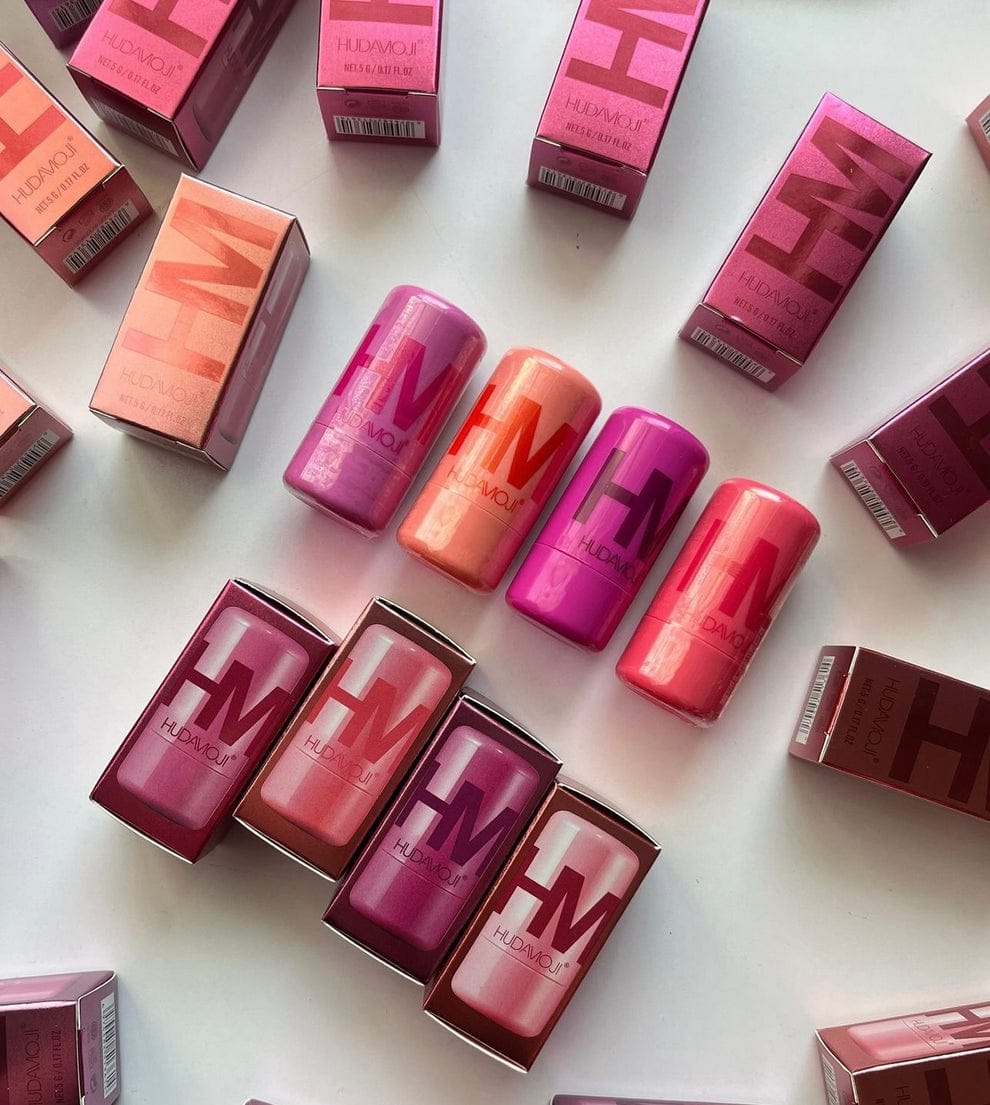 Various lipsticks and boxes on a white background